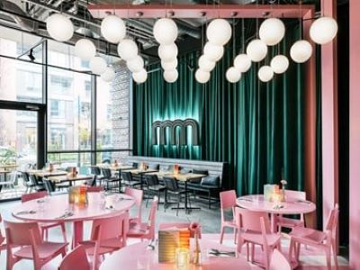 The Student Hotel Groningen The Commons Dinning With Green Curtains And Wooden Seats